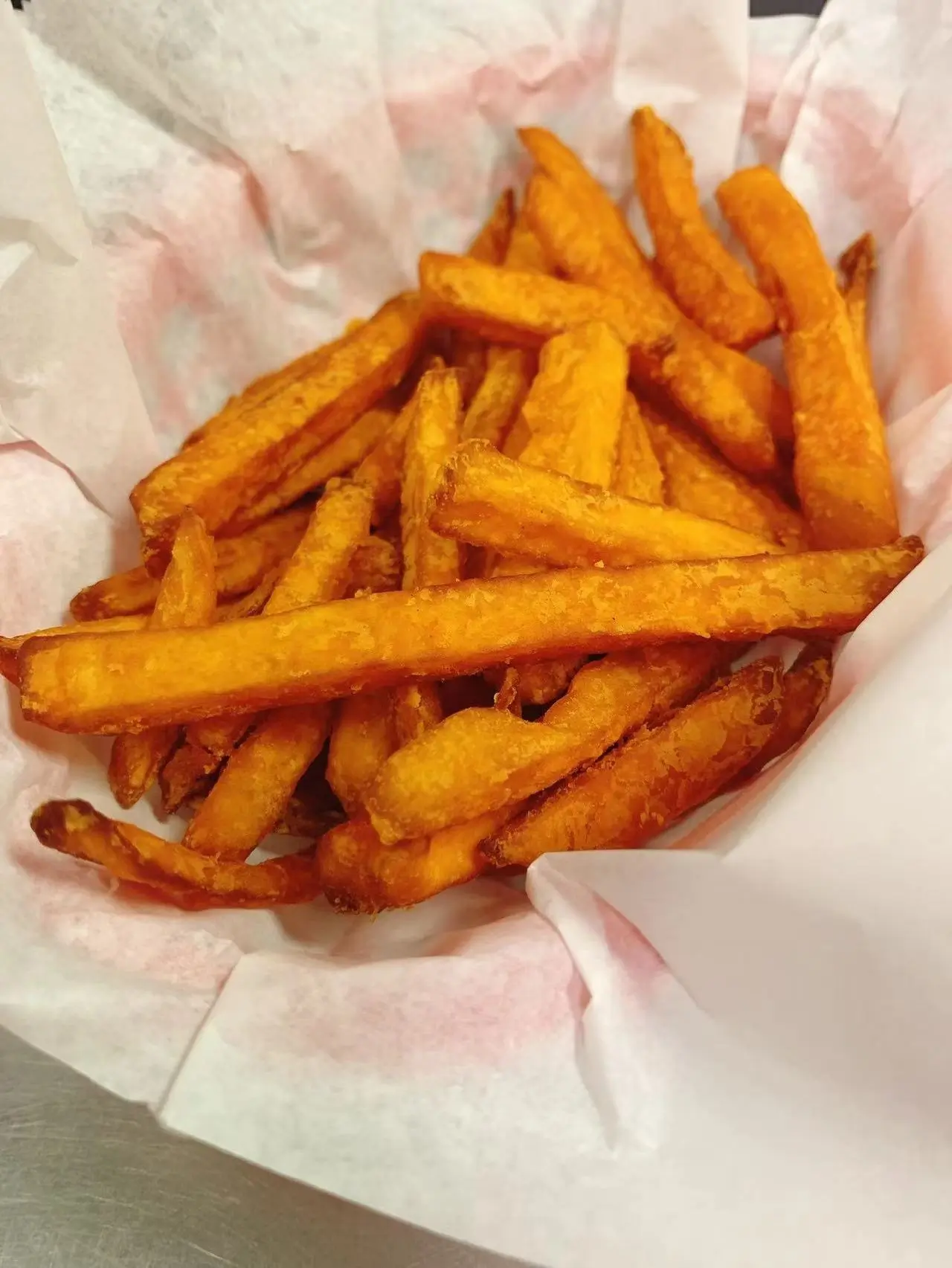 Golden crispy fried sweet potato fries at Captain Crab, a Seafood Restaurant in Lufkin